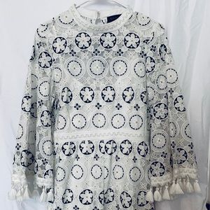 This beautiful Romper, brand new with Tag.